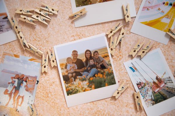 Family photos surrounded by clothespins