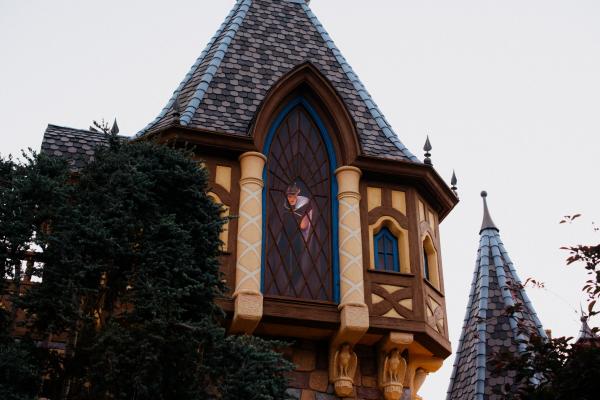 Image of tower with an evil queen peeking out of a window