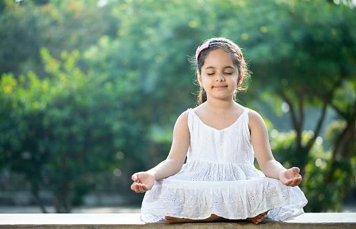 Image of young girl practicing mindfulness