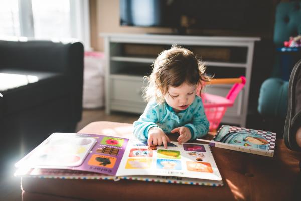 Toddler girl reading