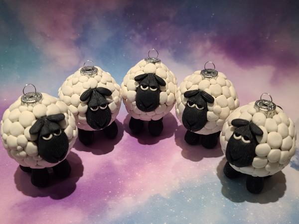 Image of five polymer clay sheep ornaments on a starry background
