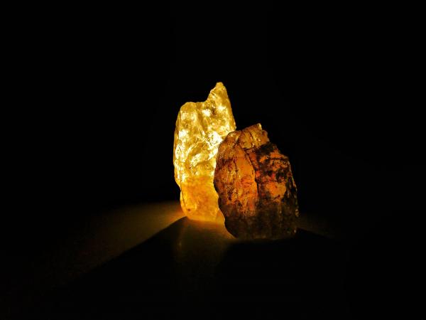 A glowing mineral against a black background