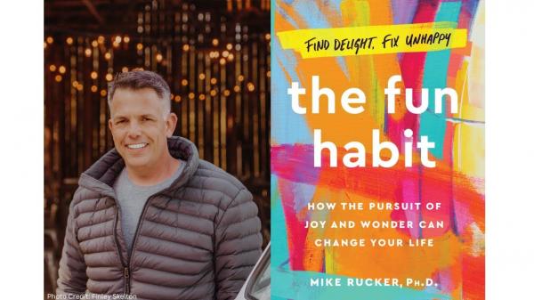 picture of the author in a gray puffy jacket next to his book the fun habit