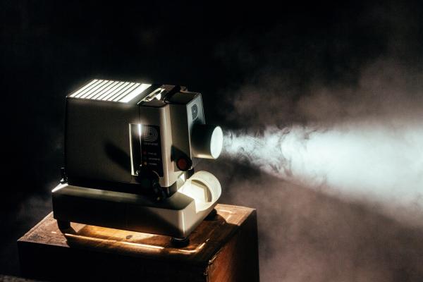 Old projector with smoke around it