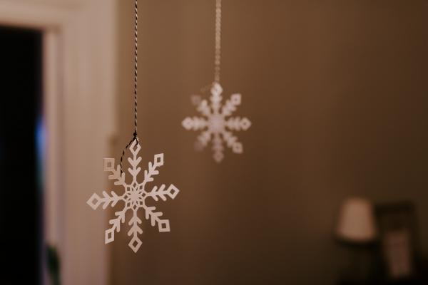 paper snowflakes hanging from ceiling
