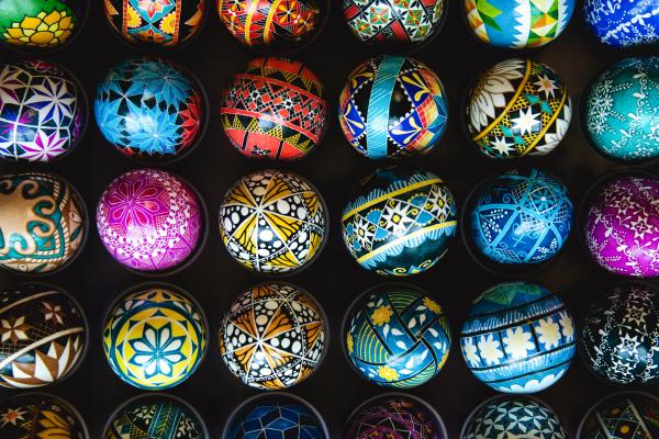 Rows of elaborately painted eggs