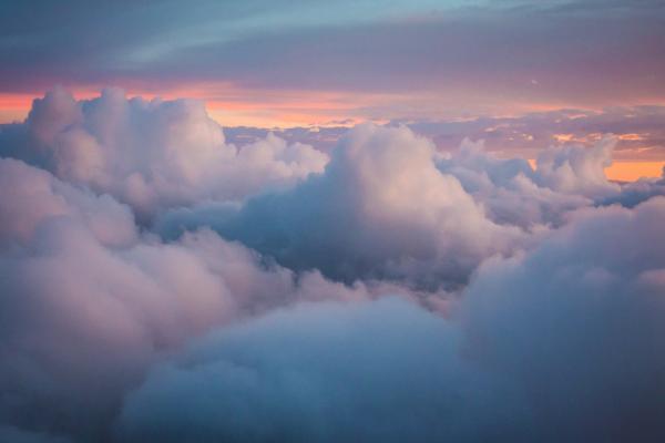 Image of fluffy clouds at sunset