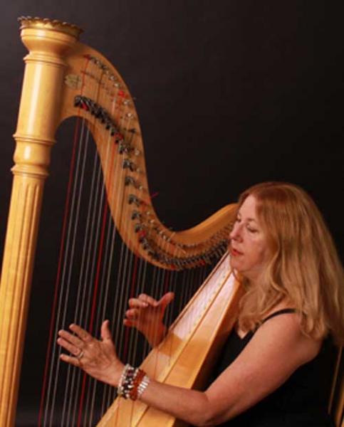 Image of Star Edwards playing a harp