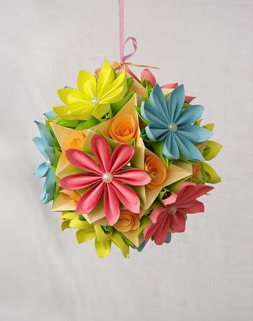 paper flower sphere in pastel yellow, pink, blue