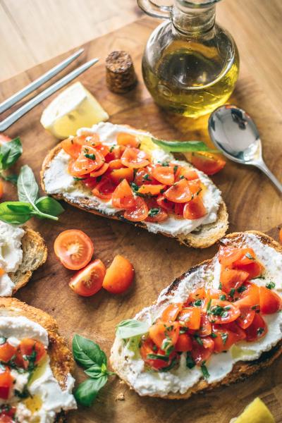 bruschetta bases with tomato, basil and olive oil toppings