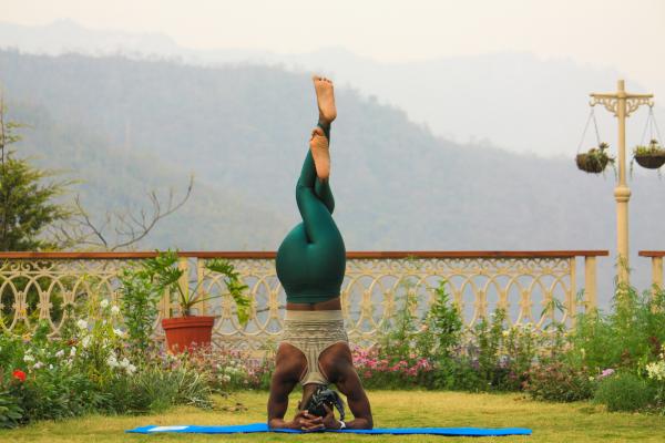 Yoga instructor doing handstand