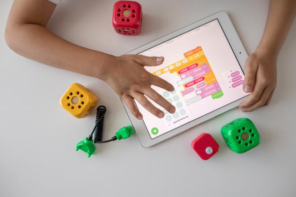 Child coding on a tablet