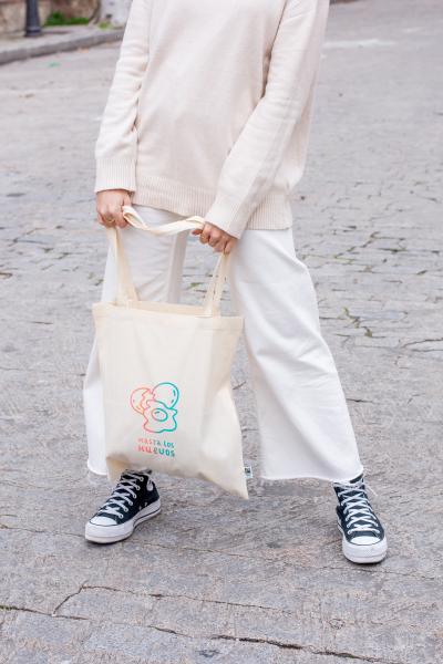 Person holding tote bag